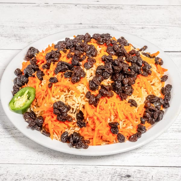 DeAfghanan Cuisine's Qabuli Palaw, a rice dish with shredded carrots, raisins, and a jalapeño garnish.